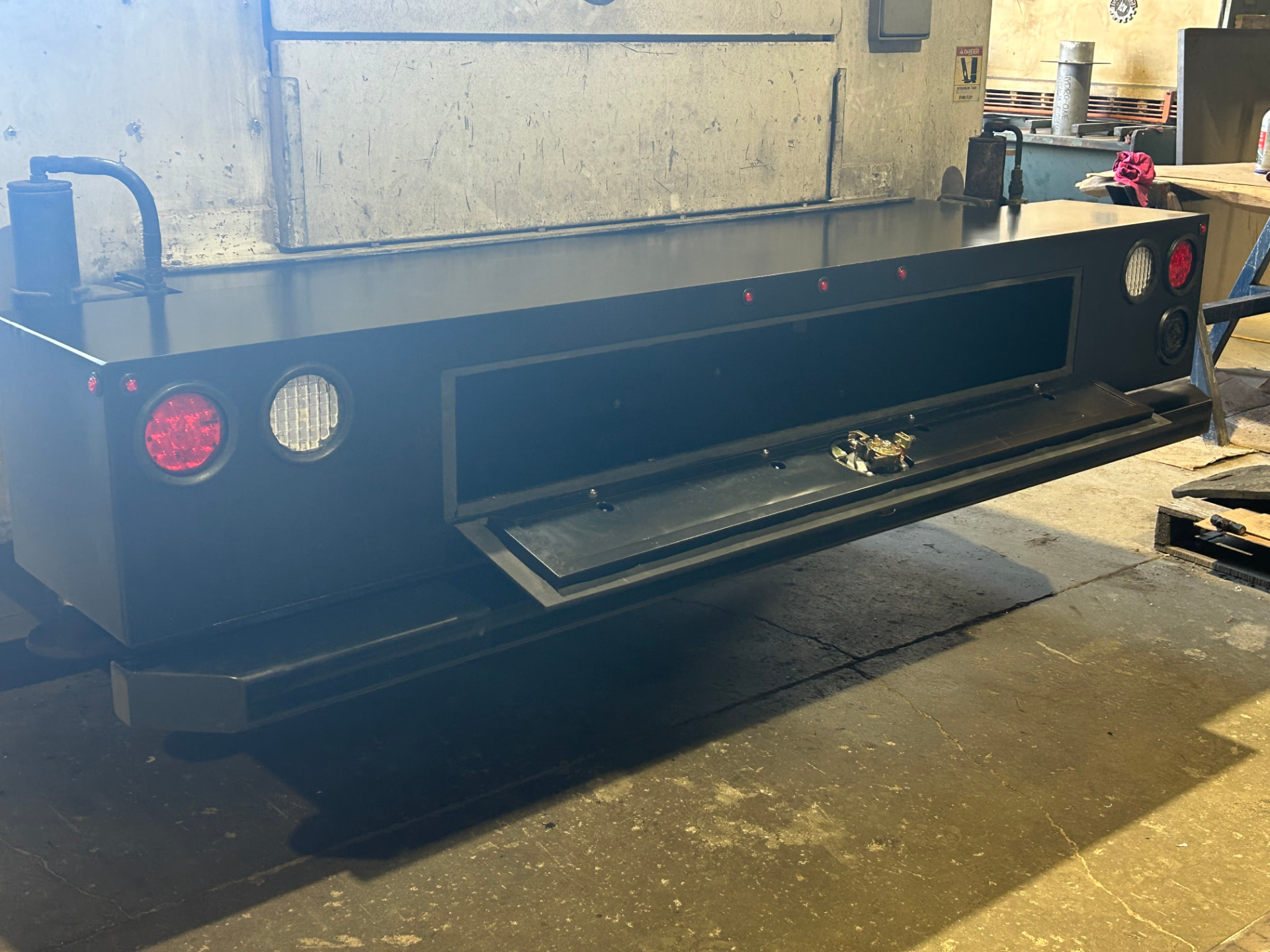 Custom truck bumper assembly with storage compartment and lighting