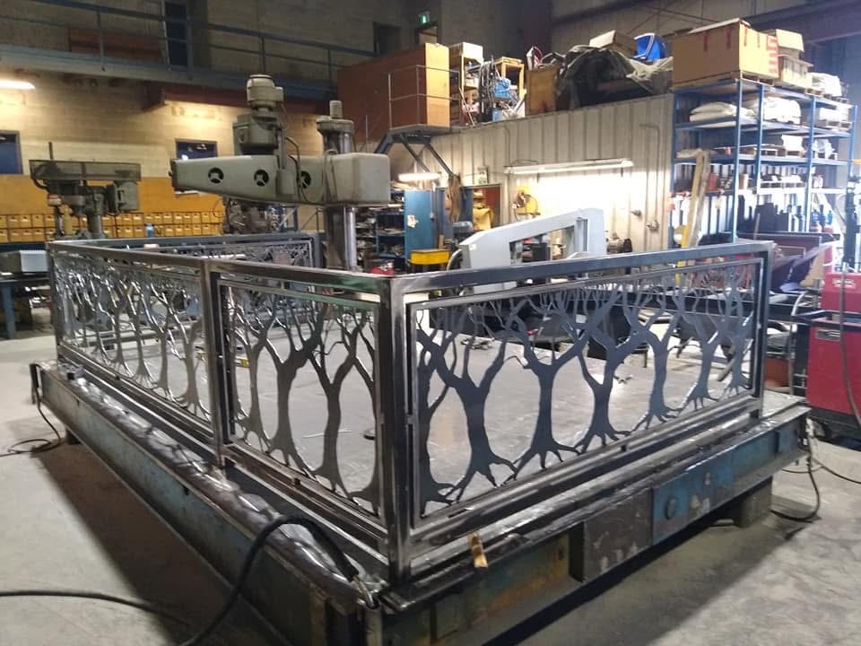 Multiple tree silhouette metal panels assembled in the workshop